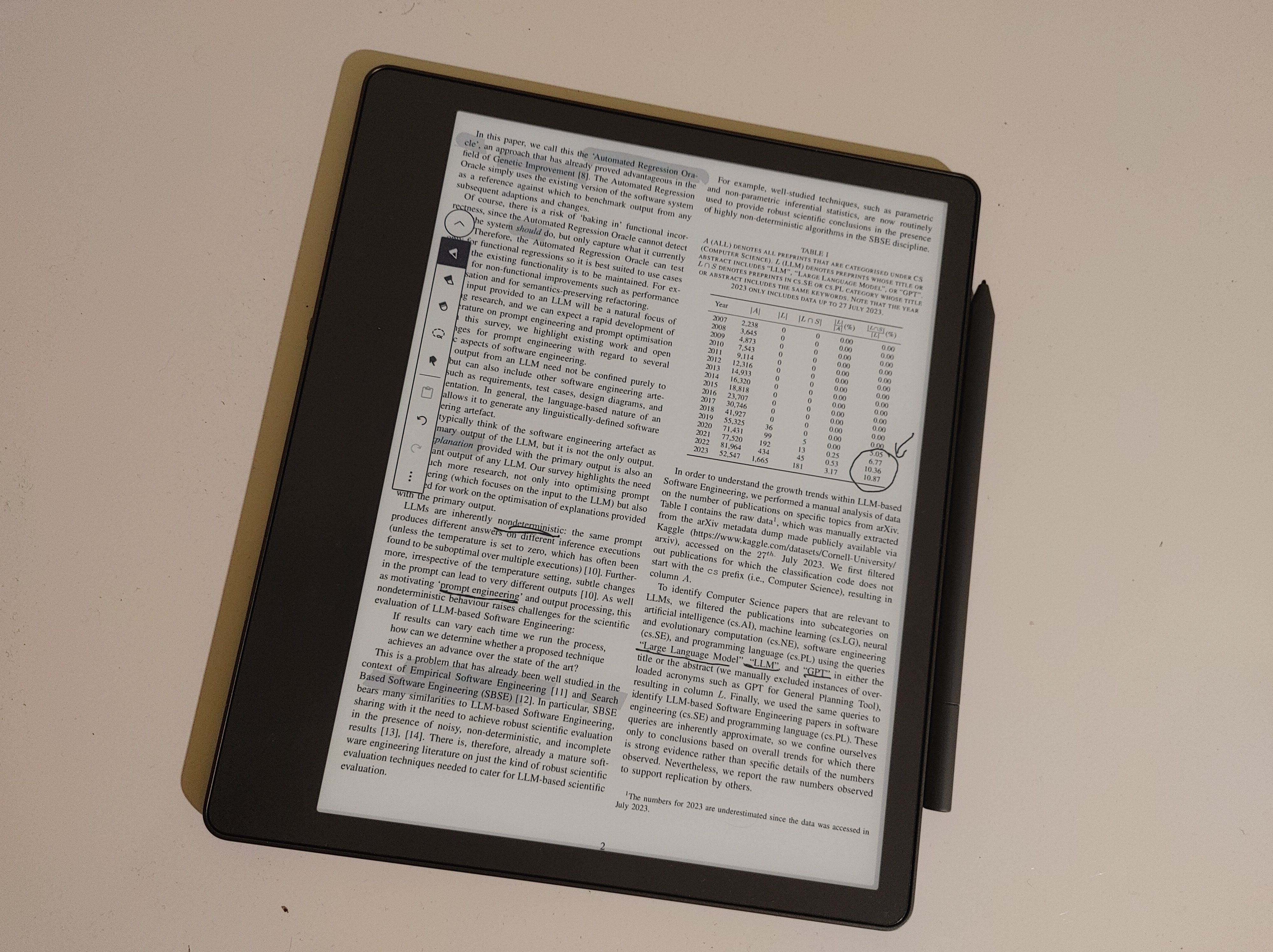 A two-column research paper in PDF format opened on Kindle Scribe eInk reader with added highlights and scribbles.